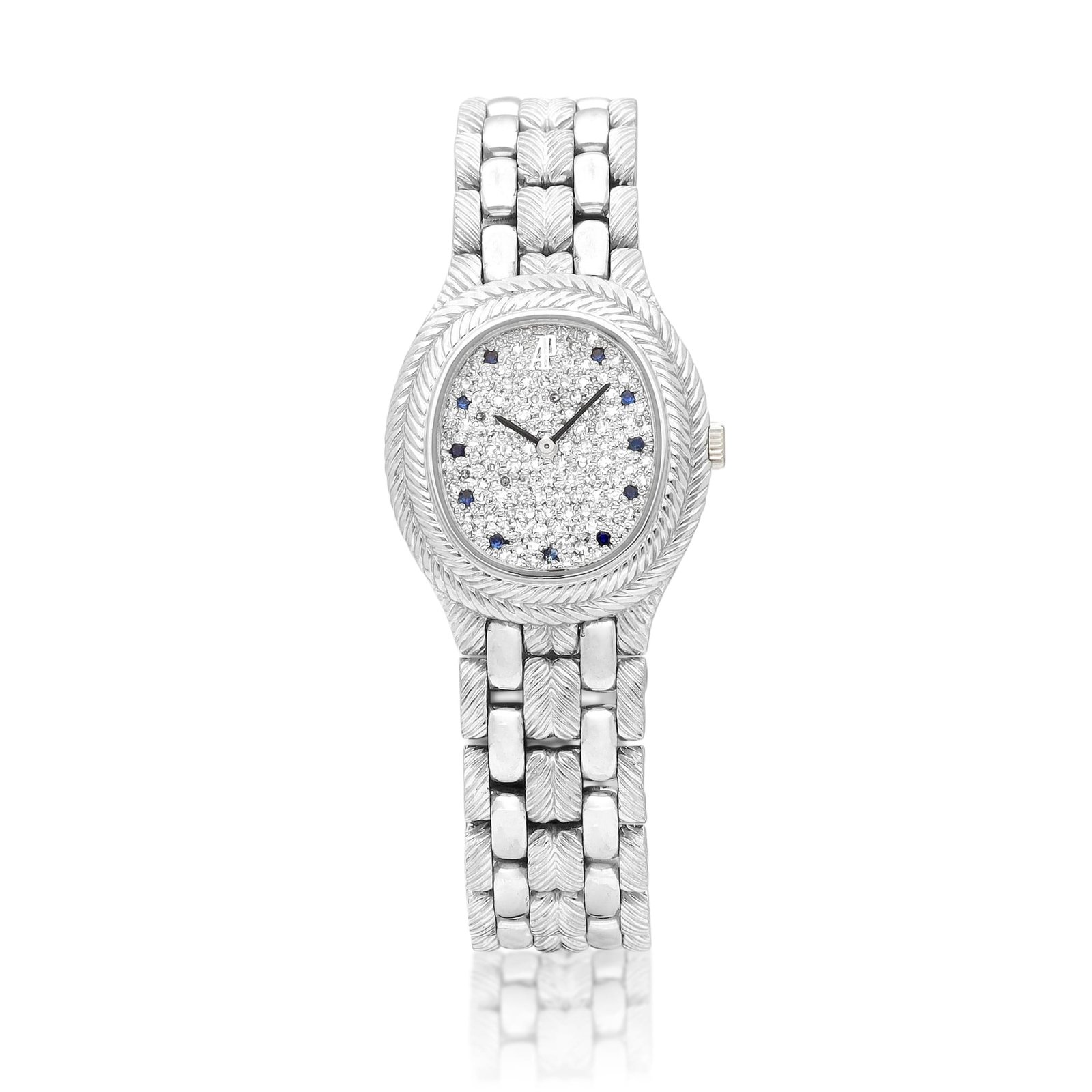 Audemars Piguet. A white gold, diamond and sapphire-set bracelet watch. 1990