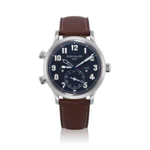 Patek Philippe Calatrava Travel Time (Reference 5524). A white gold dual time zone wristwatch with date and day and night indication. circa 2018