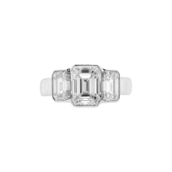 Platinum, 2.24ct Emerald Cut Diamond and Diamond Three Stone Engagement Ring