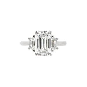 Platinum and 3.21ct Emerald Cut Diamond Three Stone Engagement Ring