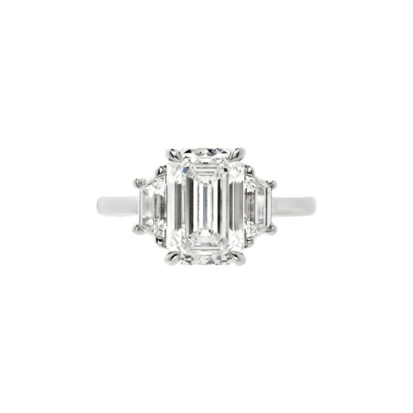 Platinum and 3.21ct Emerald Cut Diamond Three Stone Engagement Ring