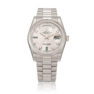 Rolex Day-Date (Reference 118239). A white gold diamond and emerald-set wristwatch with bracelet. circa 2013