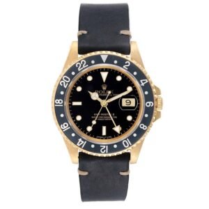 Rolex GMT Master II (Reference 16718). A yellow gold automatic wristwatch with date. 1991