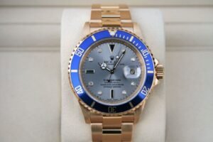 ROLEX 16618 SUBMARINER SERTI 18K YELLOW GOLD