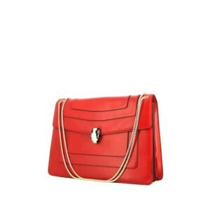 Bulgari Serpenti bag worn on the shoulder or carried in the hand in red leather