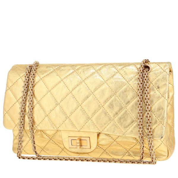 Chanel 2.55 handbag in gold quilted leather