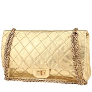 Chanel 2.55 large model handbag in gold quilted leather