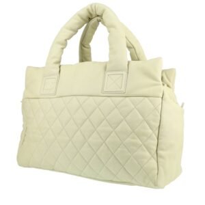 Chanel Coco Cocoon bag worn on the shoulder or carried in the hand in off-white quilted leather