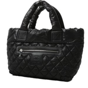 Chanel Coco Cocoon bag worn on the shoulder or carried in the hand in black quilted canvas and black leather