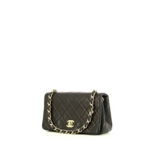 Chanel Mademoiselle bag worn on the shoulder or carried in the hand in black quilted leather