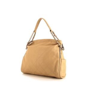 Chanel Petit Shopping handbag in beige leather