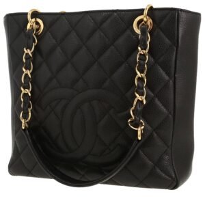 Chanel Shopping GST small model bag worn on the shoulder or carried in the hand in black quilted grained leather
