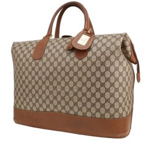 Gucci travel bag in beige monogram canvas and brown leather