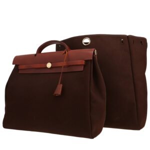 Hermès Herbag bag worn on the shoulder or carried in the hand in brown canvas and black leather