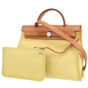 Hermès Herbag bag worn on the shoulder or carried in the hand in yellow canvas and Hunter cowhide