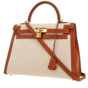 Hermès Kelly 32 cm handbag in gold Barenia leather and beige canvas