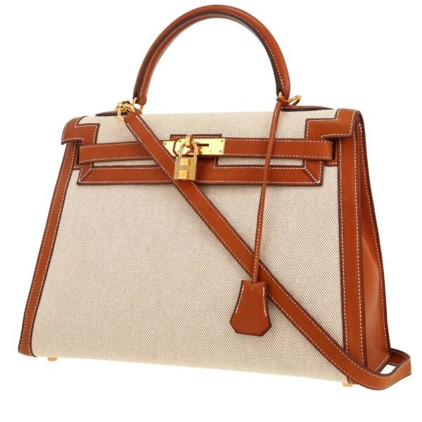 Hermès Kelly 32 cm handbag in gold Barenia leather and beige canvas