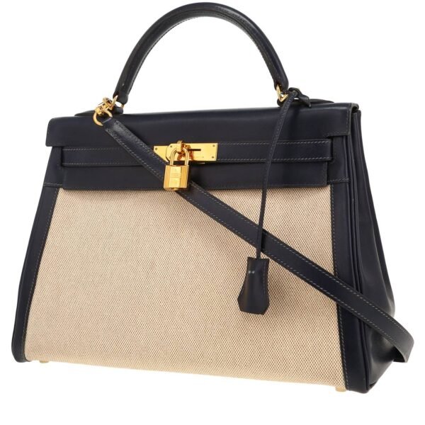 Hermès Kelly 32 cm handbag in navy blue box leather and beige canvas
