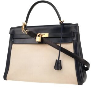 Hermès Kelly 32 cm handbag in navy blue box leather and beige canvas